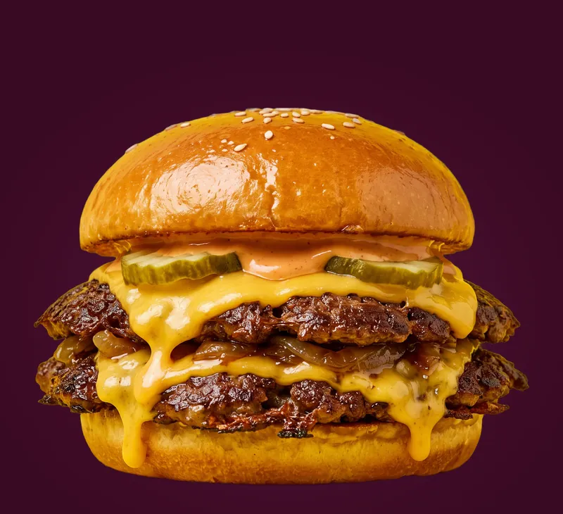 Le Double : deux steaks smashés, double cheddar qui coule, pickles, sauce maison